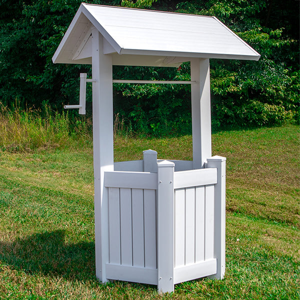 ALT TEXT:  Our Pristine White Vinyl Wishing Well Garden Structure is made in the USA and will add a decorative and pristine bright white to your garden. You can use it to cover up an unsightly section of your garden or hole and make a breathtaking statement at the same time.  . The sturdy, white vinyl construction contains the highest concentration of titanium dioxide available, stabilizing and protecting the material from ultraviolet rays, cracking, yellowing, warping, or peeling.