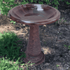 Our Antique Brown Gloss Fiber Clay Birdbath shown in a garden setting. inthegardenandmore.com