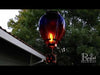 Video of our  breathtakingly beautiful Purple Solar LED Powered Hot Air Balloon Lantern features hand-painted glass panels of multi-colored hues, plus a string of flicker-happy LED lights, this lantern looks like a real hot air balloon. Hang it up and watch it glow for 6-8 hours with the included replaceable rechargeable batteries. Size is 7.5'' x 7.5'' x 23.5'' tall.